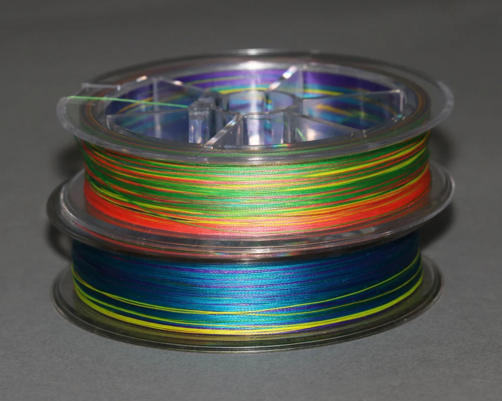 Two multi-colored fishing lines on gray background